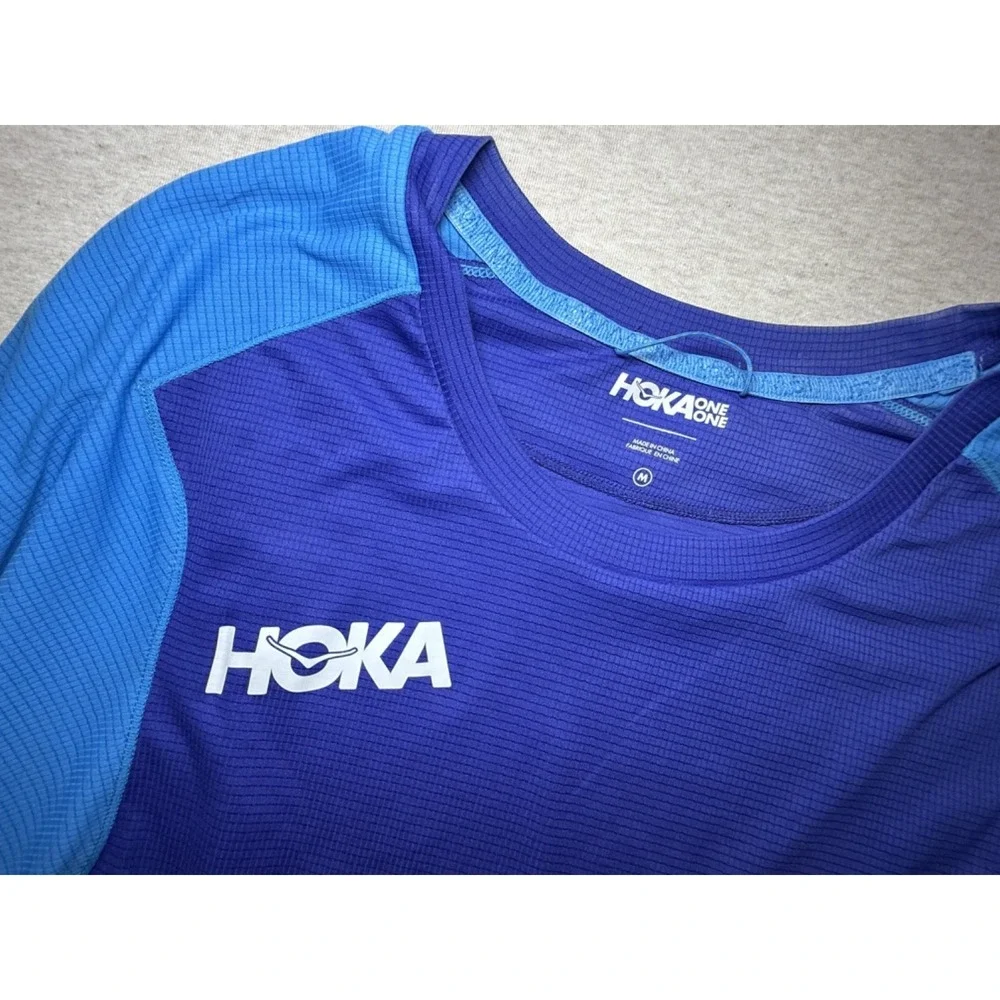 Hoka. Blue fitness shirt. size Medium. Blue 100% polyester 3/4 sleeve shirt